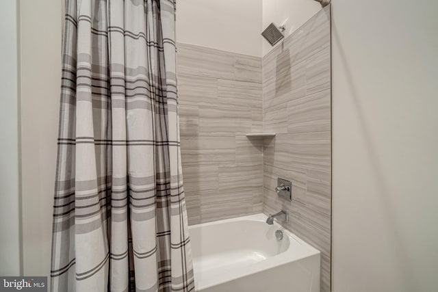 bathroom with shower / tub combo with curtain