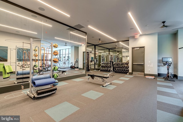 workout area featuring baseboards and visible vents