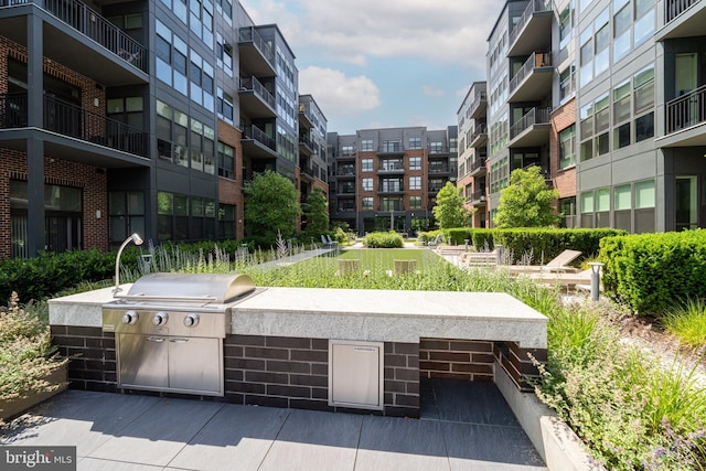 view of community featuring exterior kitchen