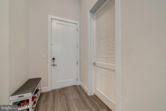 entryway with wood finished floors