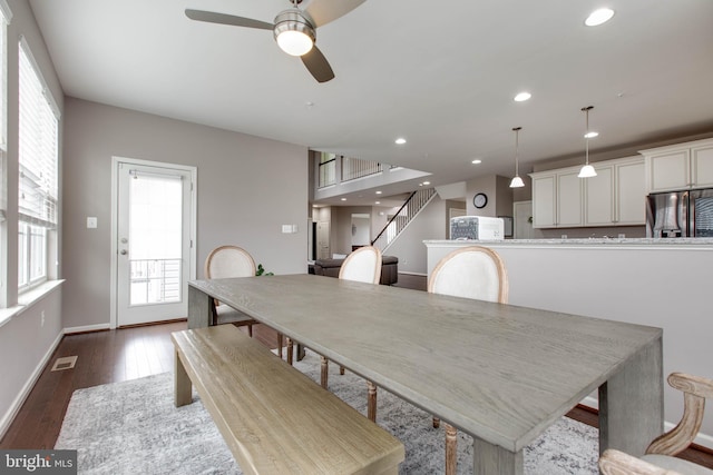 dining area with recessed lighting, dark wood-style flooring, visible vents, baseboards, and stairs