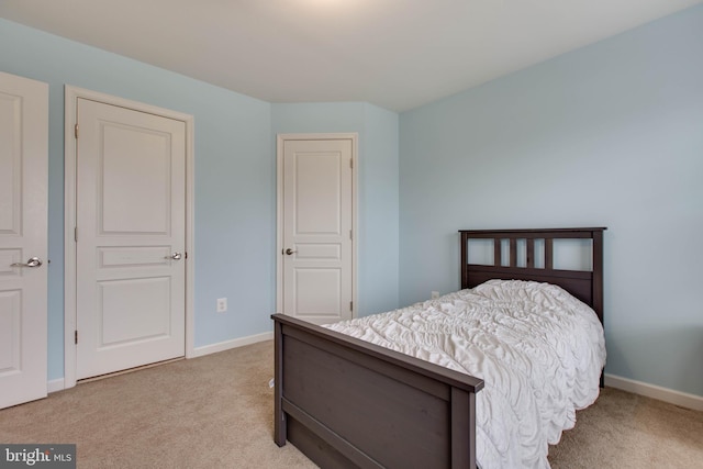 bedroom with carpet and baseboards