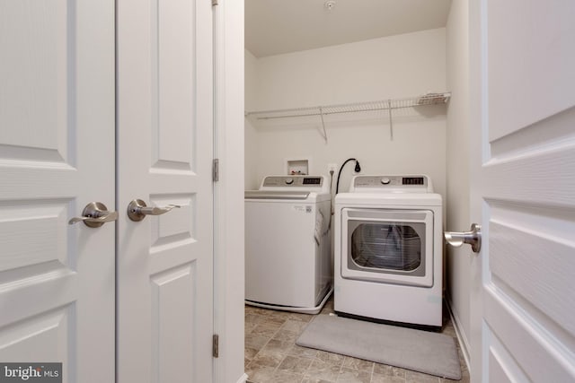 laundry room with laundry area and washer and clothes dryer