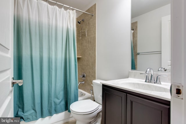 full bathroom featuring toilet, shower / bath combo, and vanity