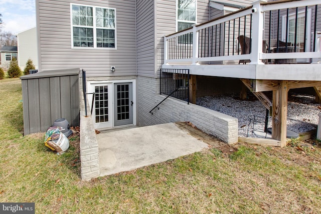 rear view of property with a yard and a patio