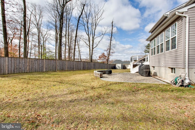 view of yard with a patio and a fenced backyard