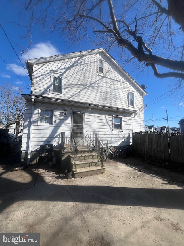 traditional-style house with fence