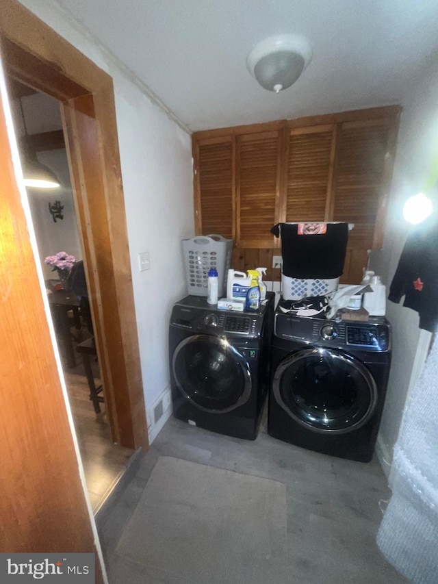 clothes washing area with laundry area and washing machine and dryer