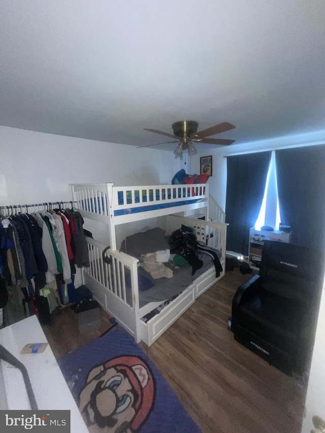 bedroom with ceiling fan and wood finished floors