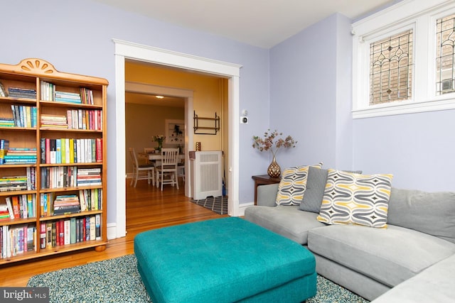 living room featuring wood finished floors and baseboards