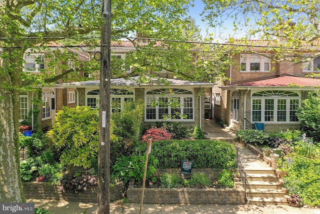 view of front of home with brick siding