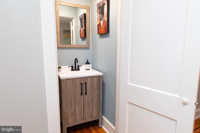 bathroom featuring vanity and wood finished floors