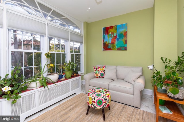 sunroom / solarium featuring radiator heating unit