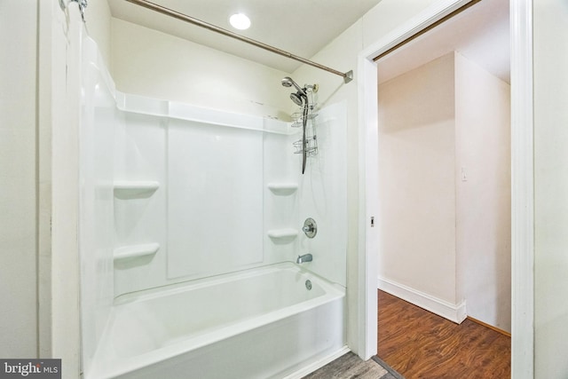 full bath with  shower combination and wood finished floors