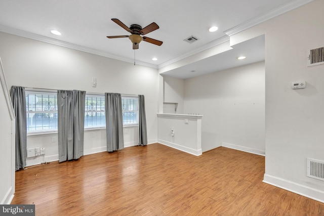 unfurnished living room with visible vents and wood finished floors