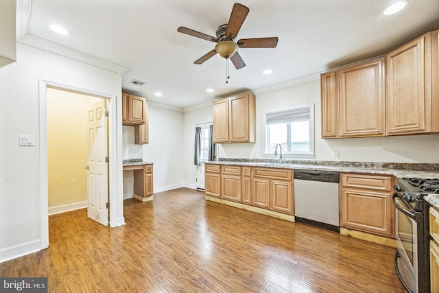 kitchen with ornamental molding, appliances with stainless steel finishes, recessed lighting, and light wood-style floors