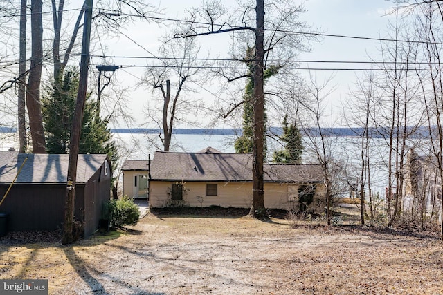 view of side of property with an outbuilding and a storage unit