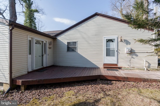 back of house with a wooden deck