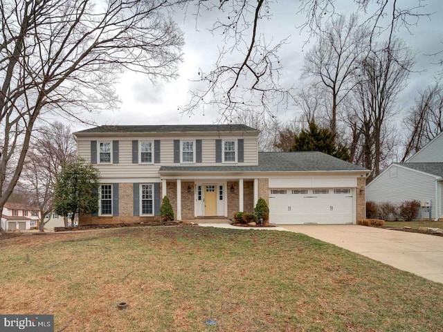 view of front of home with brick siding, an attached garage, concrete driveway, and a front yard