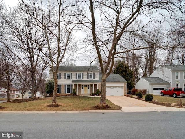 view of front facade featuring brick siding, an attached garage, concrete driveway, and a front yard