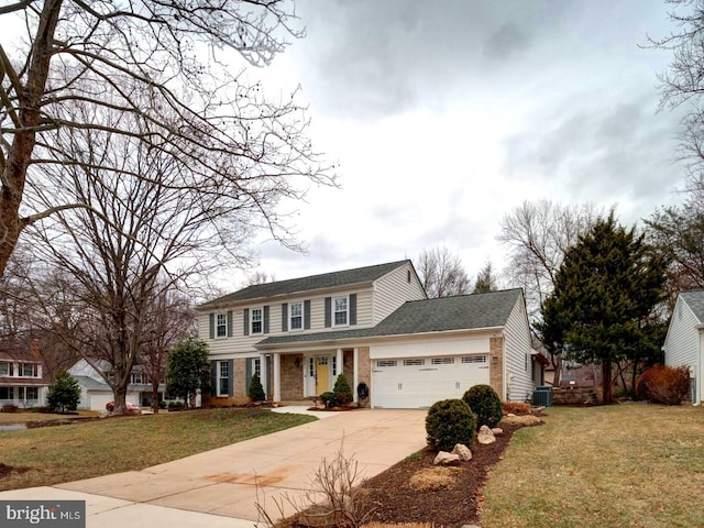 view of front of home with a front lawn, concrete driveway, a garage, central air condition unit, and brick siding