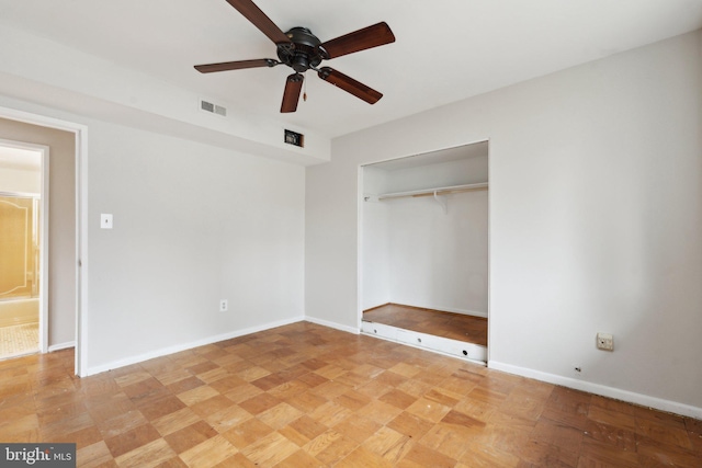 unfurnished bedroom featuring ceiling fan, a closet, visible vents, and baseboards