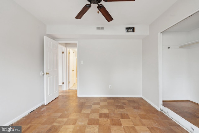 unfurnished bedroom featuring a closet, visible vents, ceiling fan, and baseboards