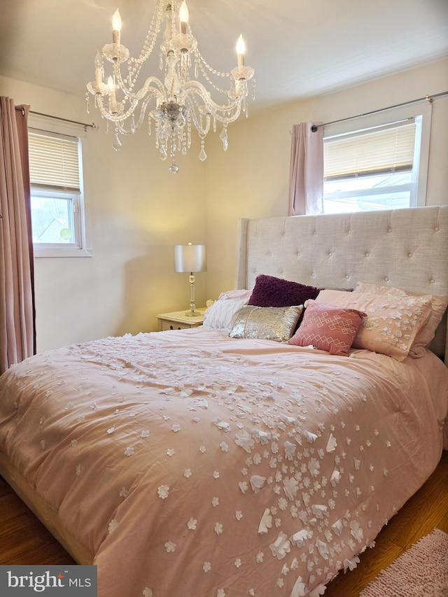 bedroom featuring an inviting chandelier