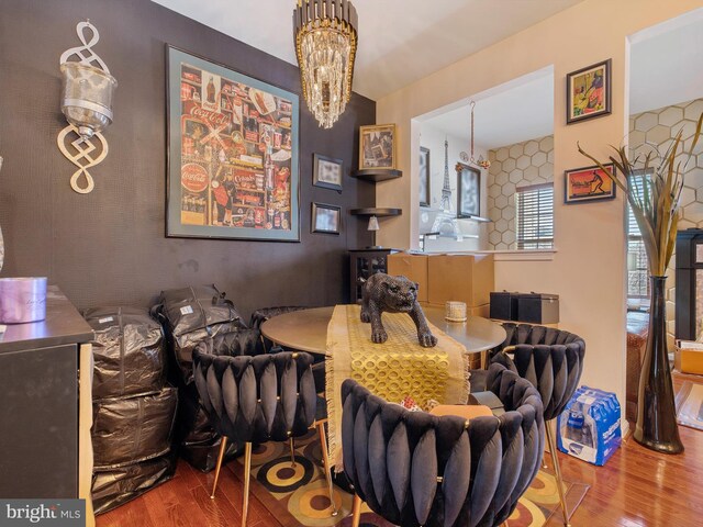 dining room with an inviting chandelier and wood finished floors