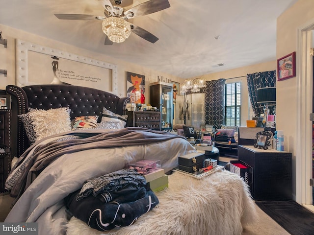 bedroom with visible vents and a ceiling fan