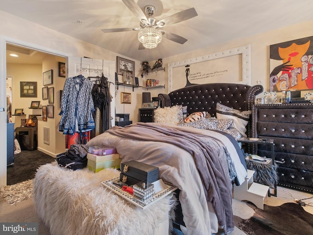 bedroom with ceiling fan and carpet floors