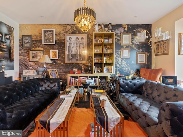 living area featuring wallpapered walls, an inviting chandelier, and an accent wall