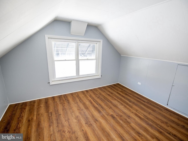 bonus room with vaulted ceiling and wood finished floors