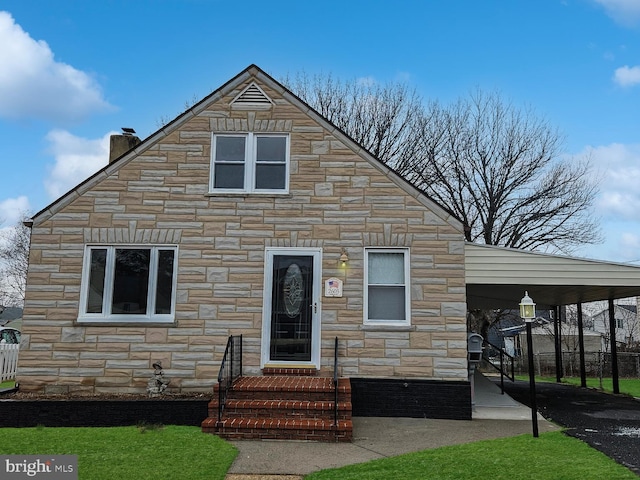 view of front facade with stone siding and a chimney