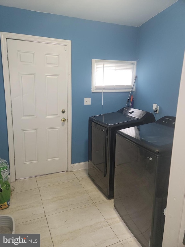 clothes washing area with laundry area and washing machine and dryer