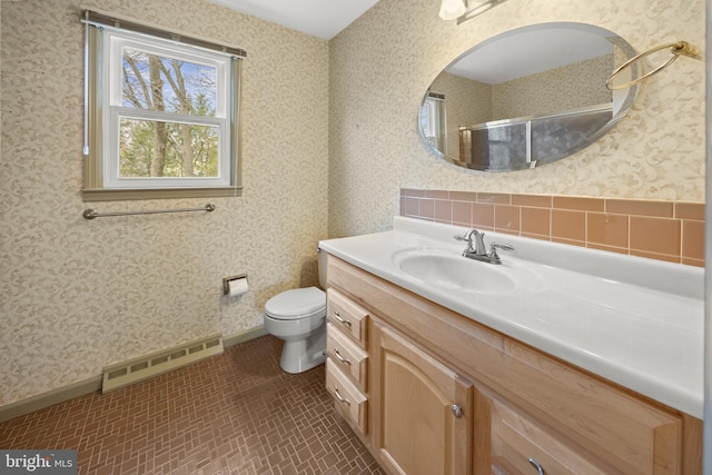 full bath with visible vents, wallpapered walls, toilet, vanity, and walk in shower