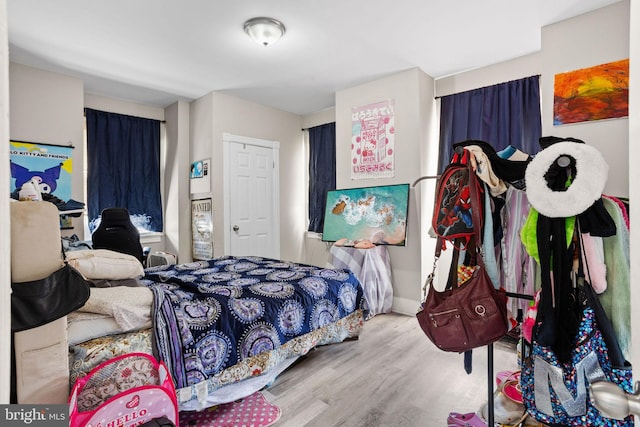 bedroom with wood finished floors