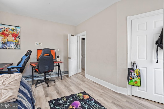 home office with wood finished floors and baseboards