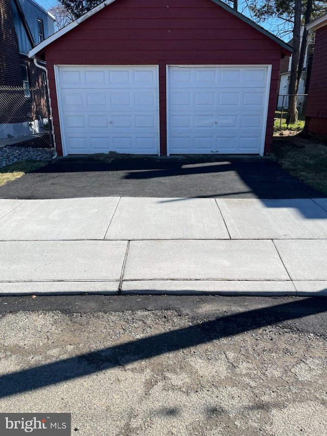 garage featuring fence