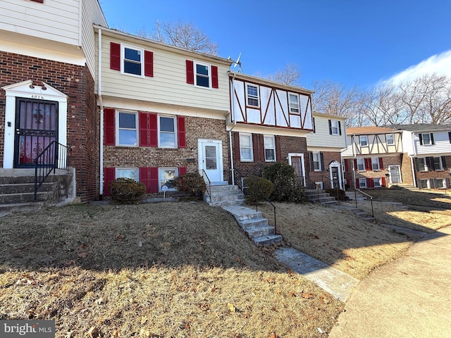 view of front of home with brick siding