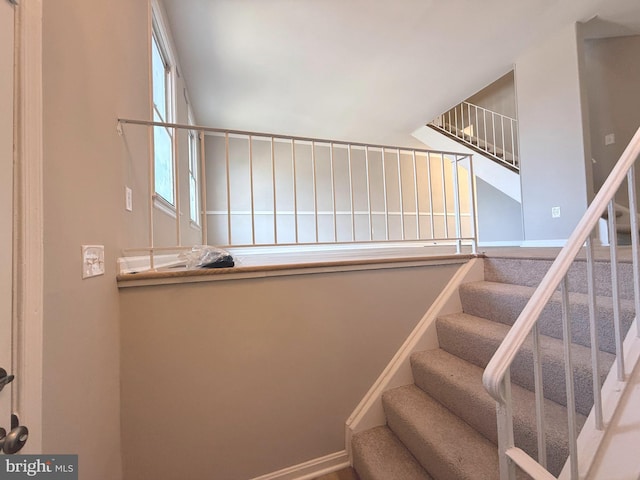 stairs featuring baseboards