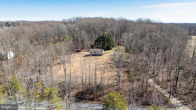 drone / aerial view with a view of trees