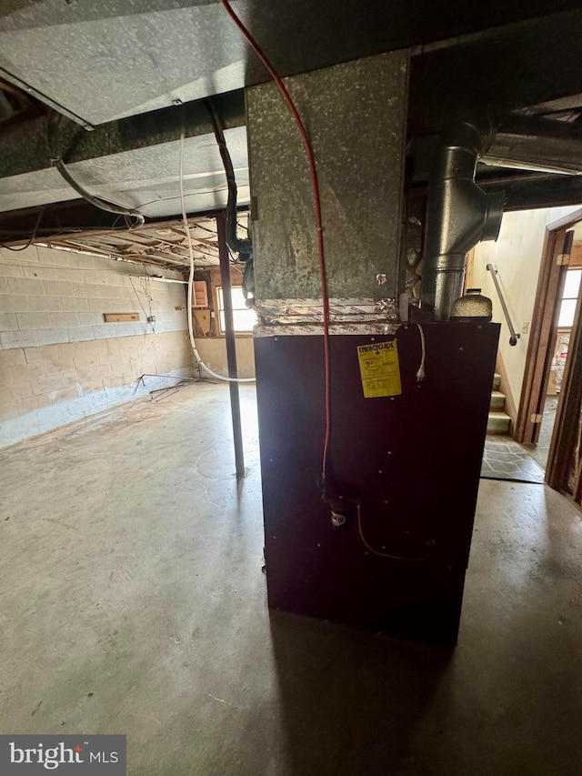 utility room featuring heating unit