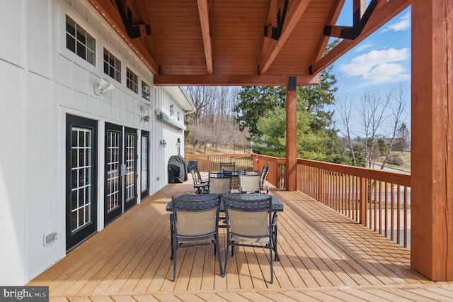 wooden deck with outdoor dining area