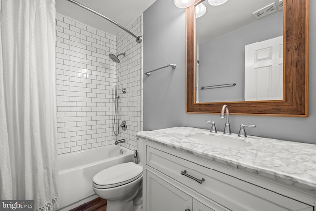 full bathroom with visible vents, toilet, shower / bath combo, and vanity