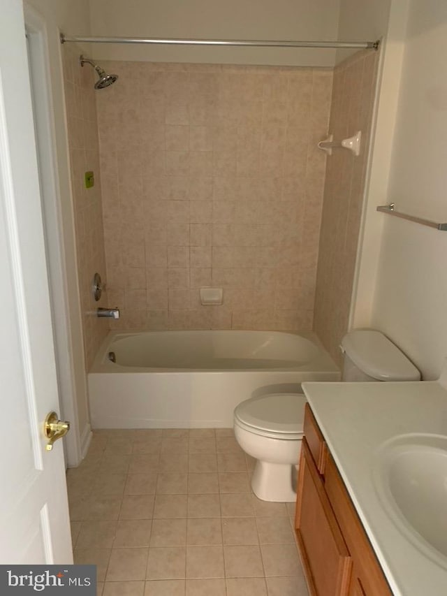 bathroom featuring tile patterned flooring, shower / tub combination, vanity, and toilet