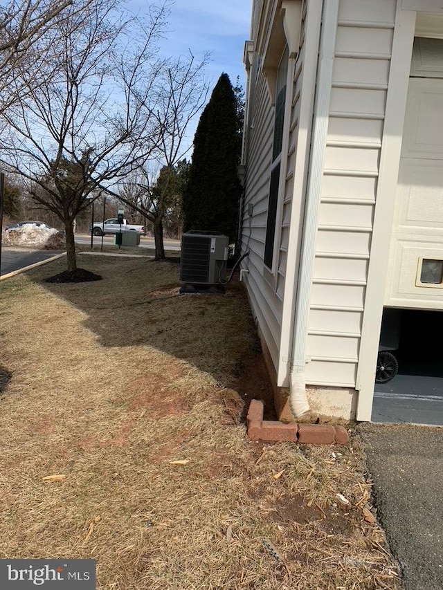 view of side of property featuring central AC unit