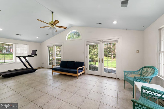 sitting room featuring lofted ceiling, french doors, visible vents, and light tile patterned floors