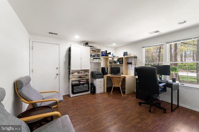 office space with dark wood-style floors, visible vents, and recessed lighting