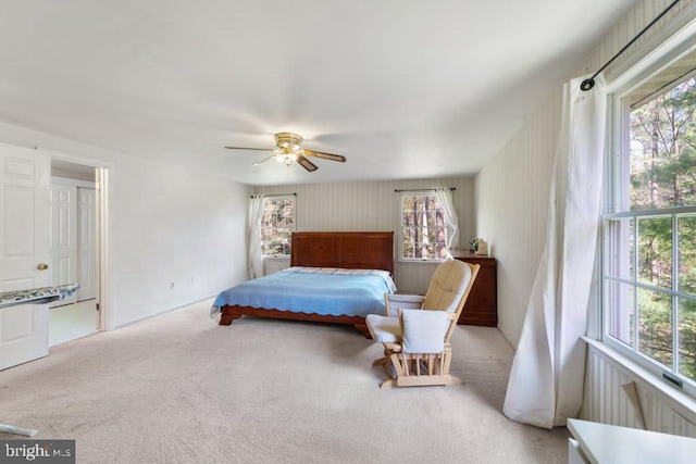 carpeted bedroom with a ceiling fan